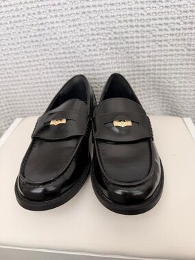 Classic Black Penny Loafers with Gold Accent